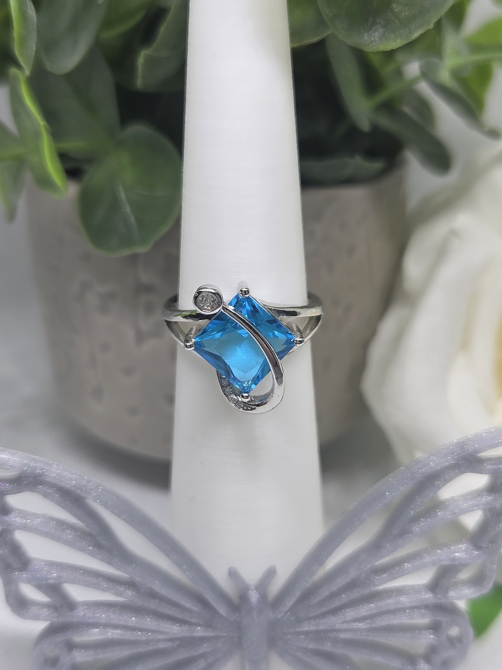 Elegant Silver Blue Topaz Swirl Ring